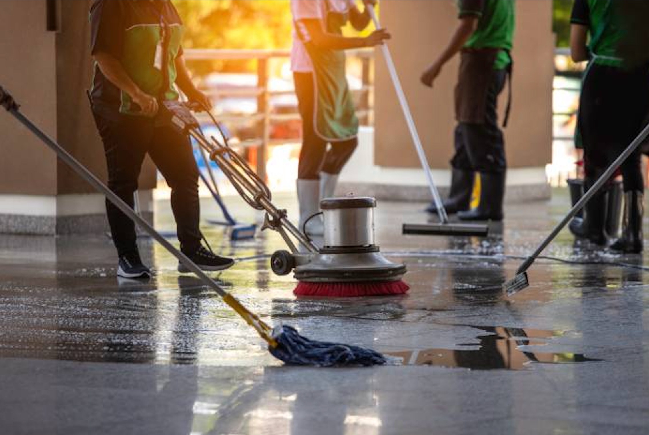 Team performing commercial cleaning in a workplace